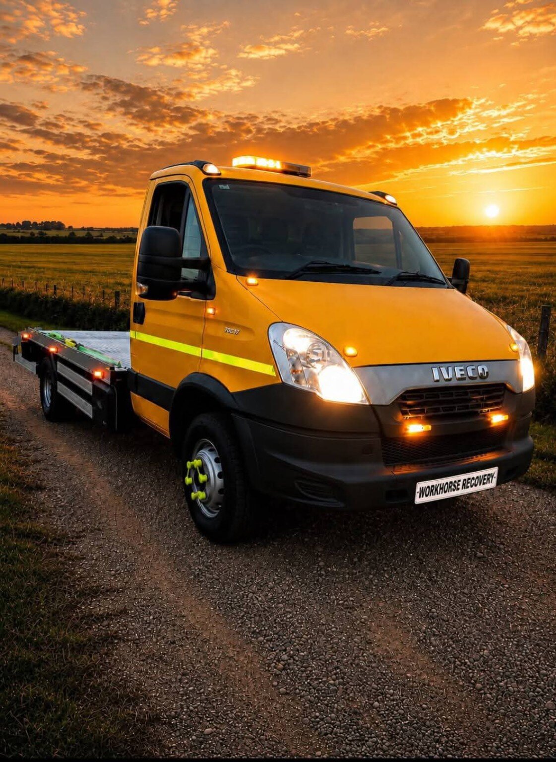 Yellow Workhorse Recovery truck at sunset